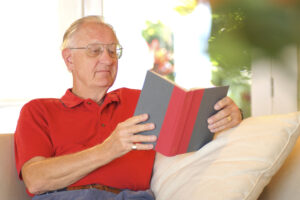Senior reading an essential book in retirement