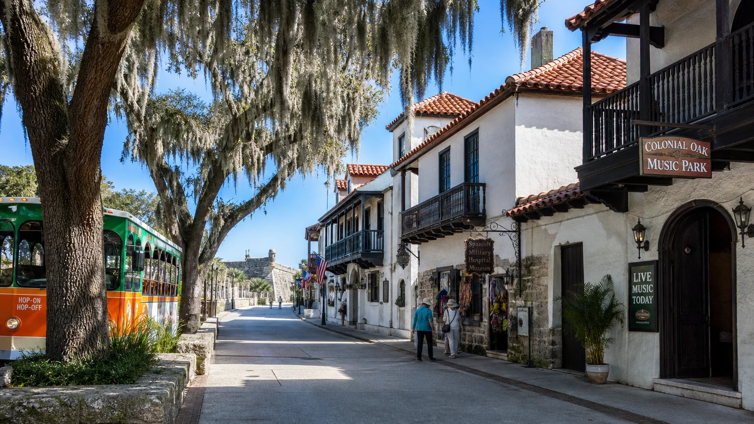 The pedestrian-only St. George Street in St. Augustine featuring Spanish architecture and Spanish moss hanging from oak trees.